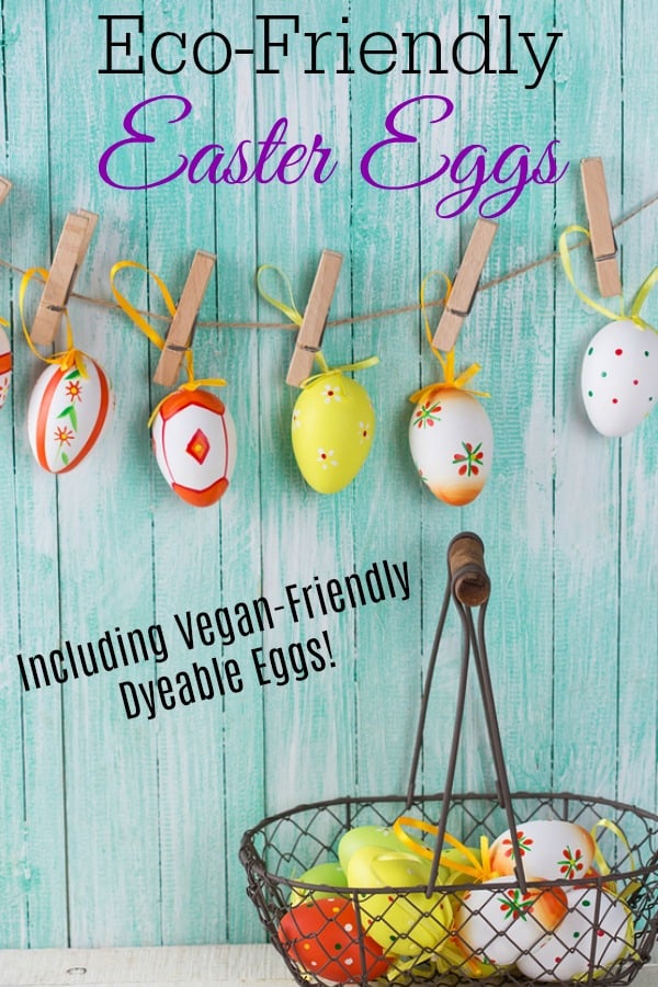 Colorful easter eggs in bucket and on clothes line on wooden background.
