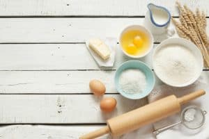 baking ingredients on a white wooden background