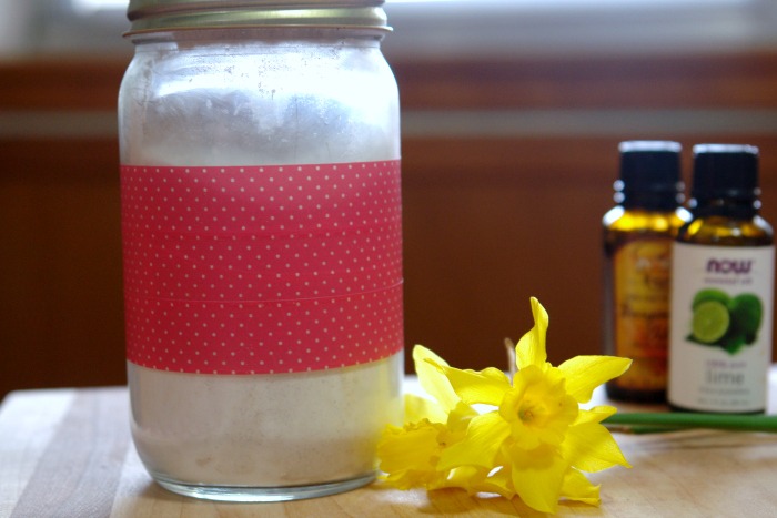 glass jar with natural citrus fresh natural carpet freshener with yellow flowers and essential oils