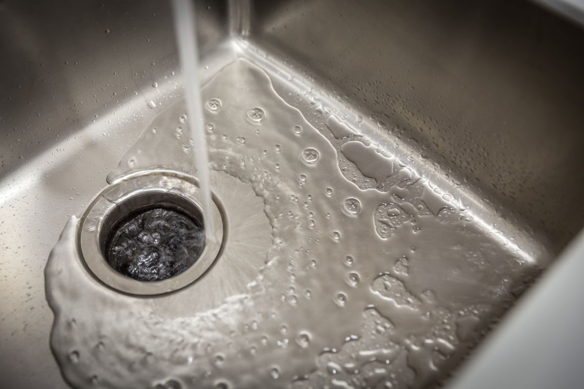 water running in stainless steel sink