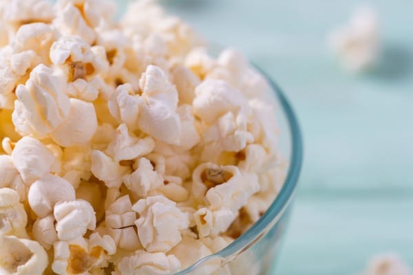 upclose popcorn on turquoise wooden surface