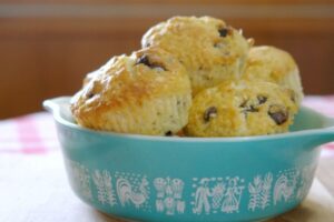 chocolate chip muffins in a vintage Pyrex butterprint bowl