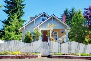 vintage blue home with white picket fence