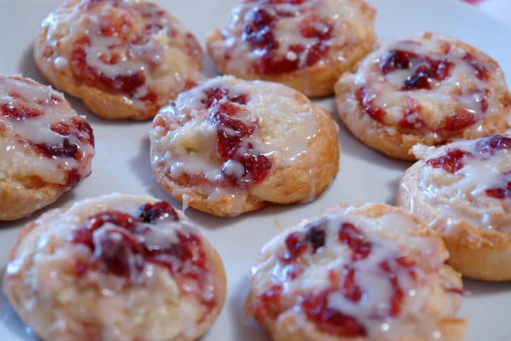 cranberry cream cheese danishes on white plate