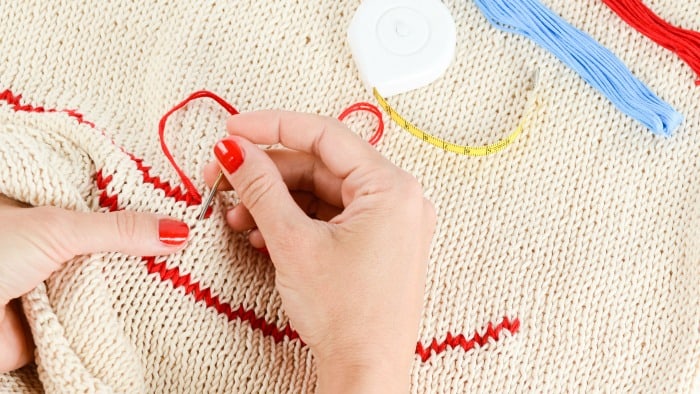 woman embroidering 