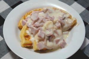 waffles on plate with creamed ham