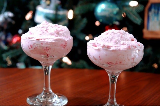 glasses with peppermint fluff in front of Christmas tree