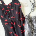 black cherry print dress with black and white gingham apron